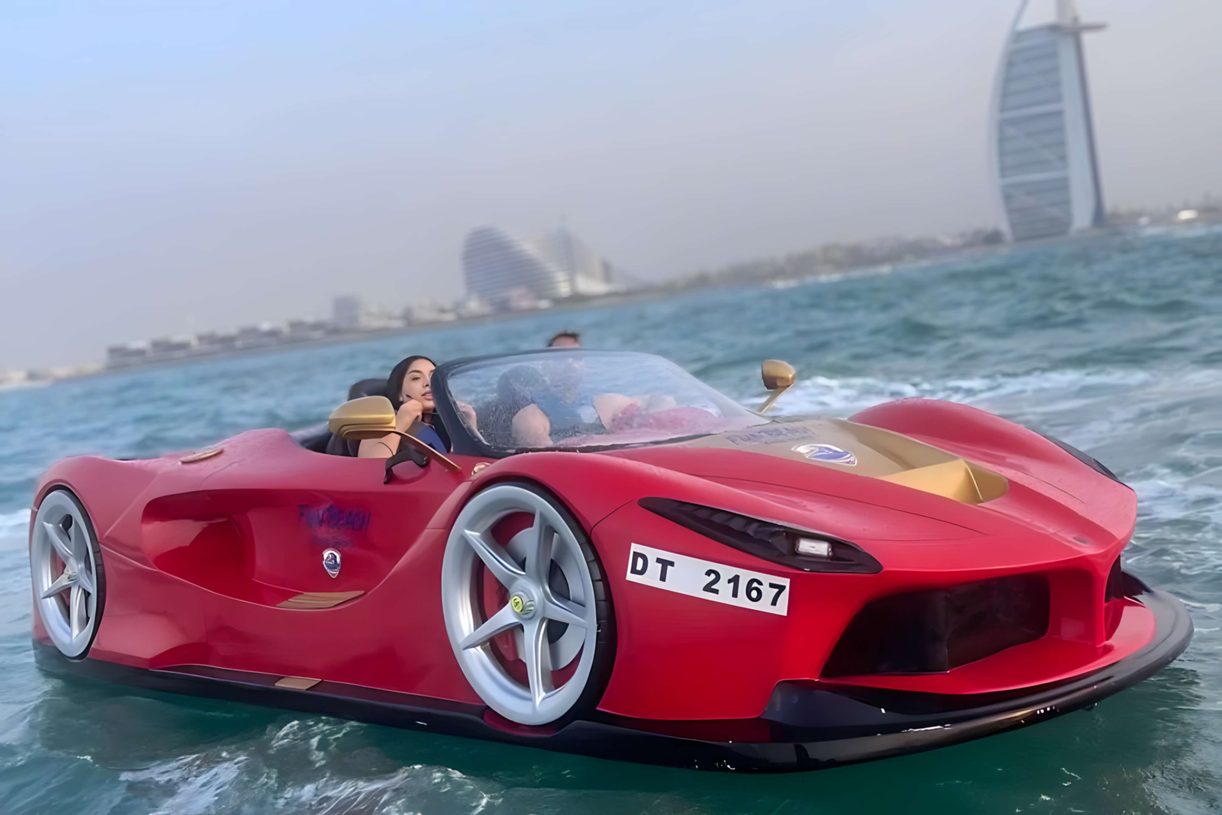 Bright red Fun Beach jet car speeding across the water in Dubai