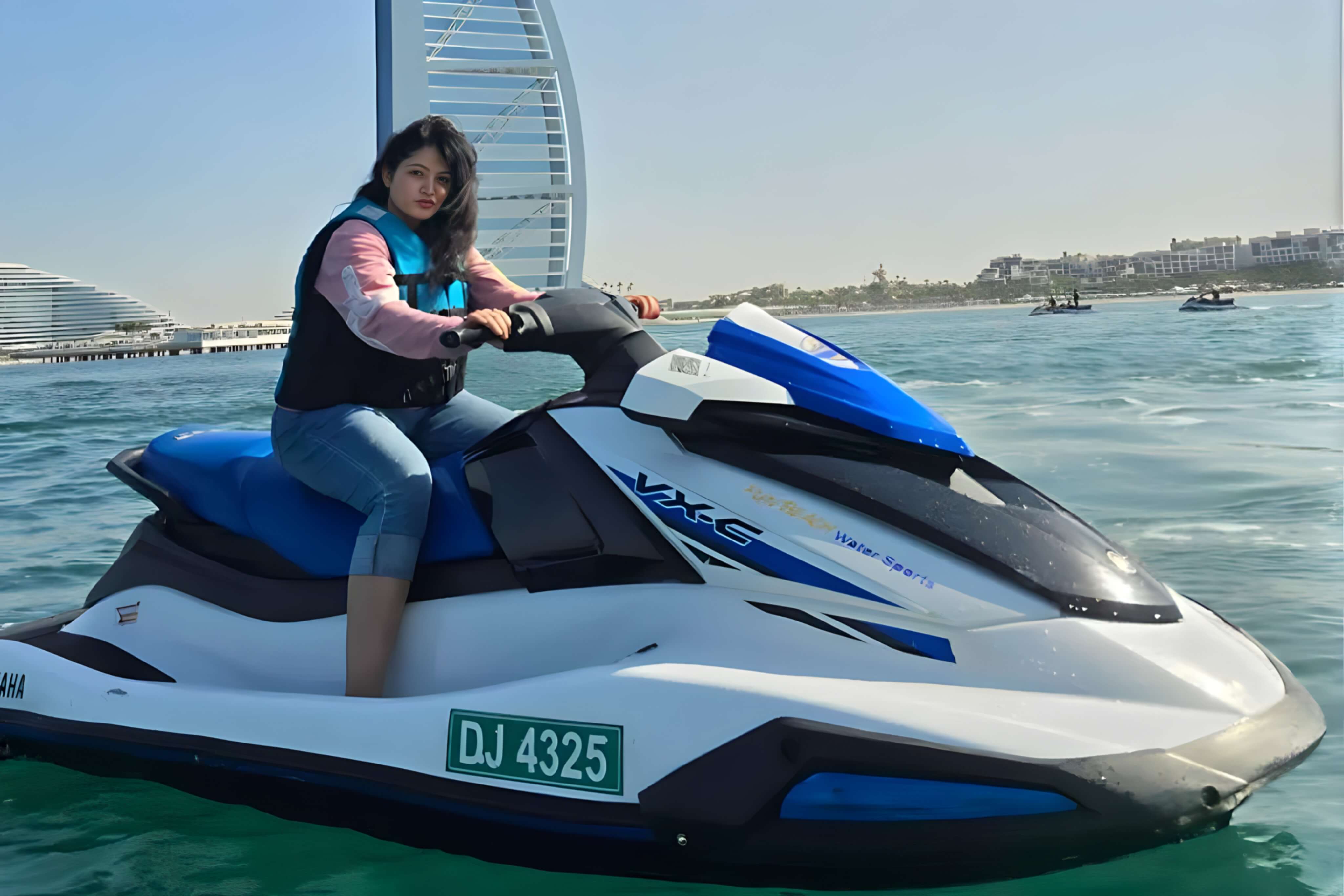 Fun Beach Water Sports rider on a jet ski next to the Burj Al Arab in Dubai
