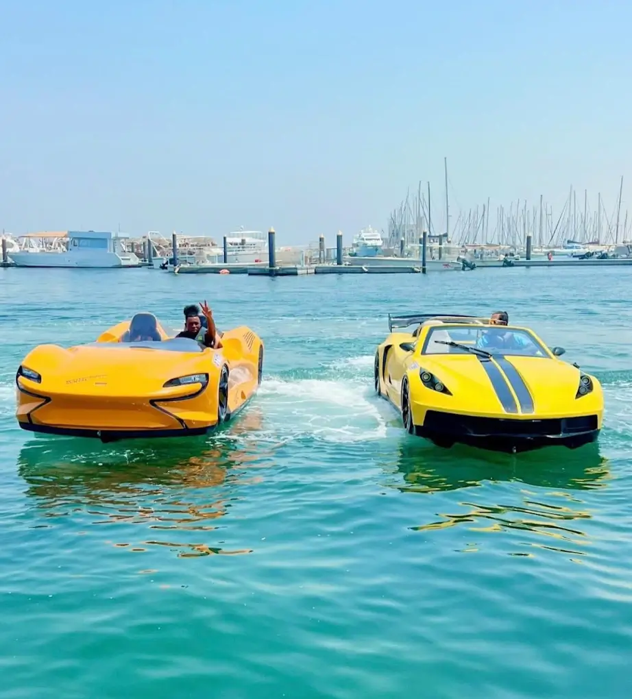 Yellow amphibious jet cars on the water in Dubai