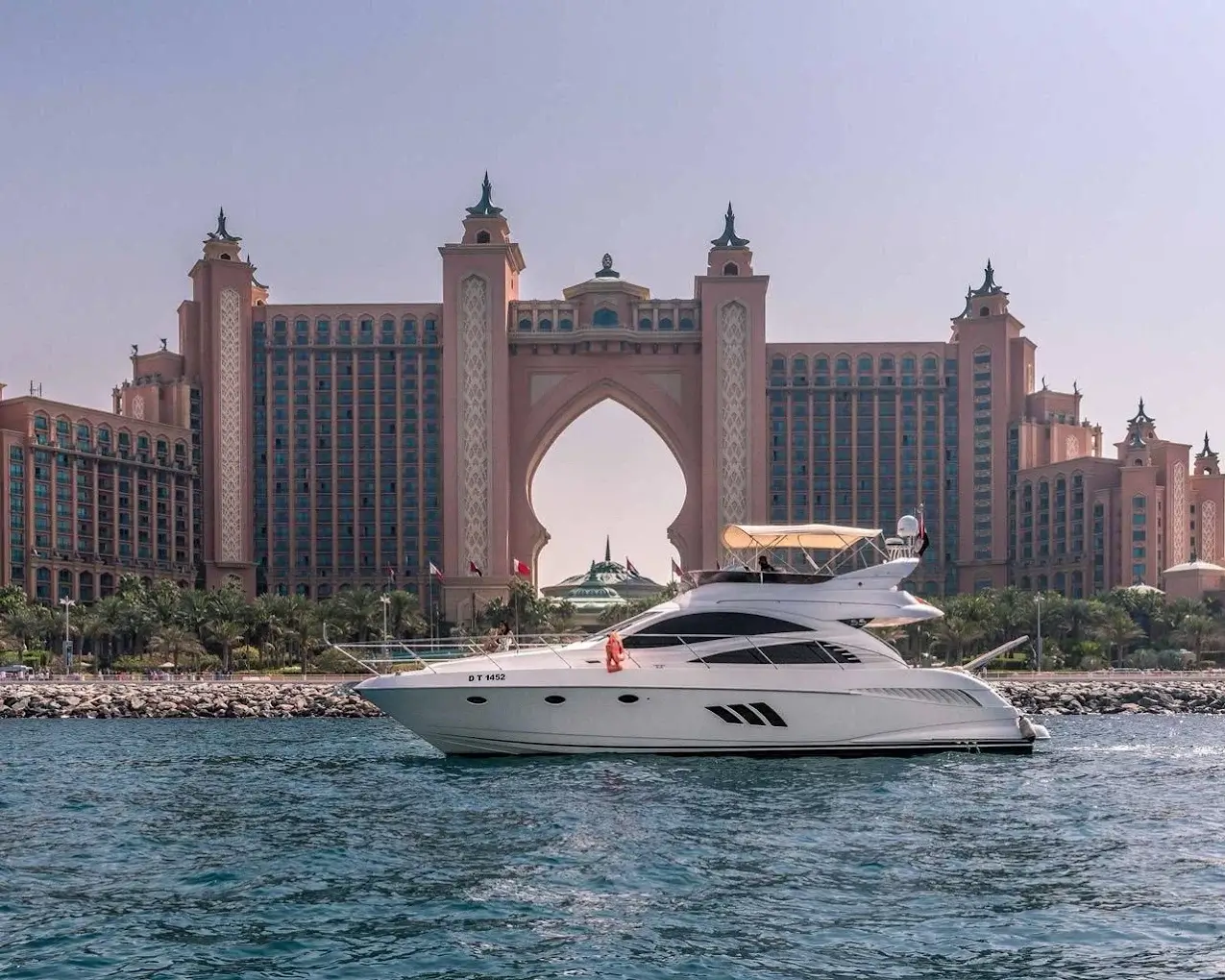 Trail Blazer Yachts luxury motor yacht cruising in front of Atlantis The Palm in Dubai